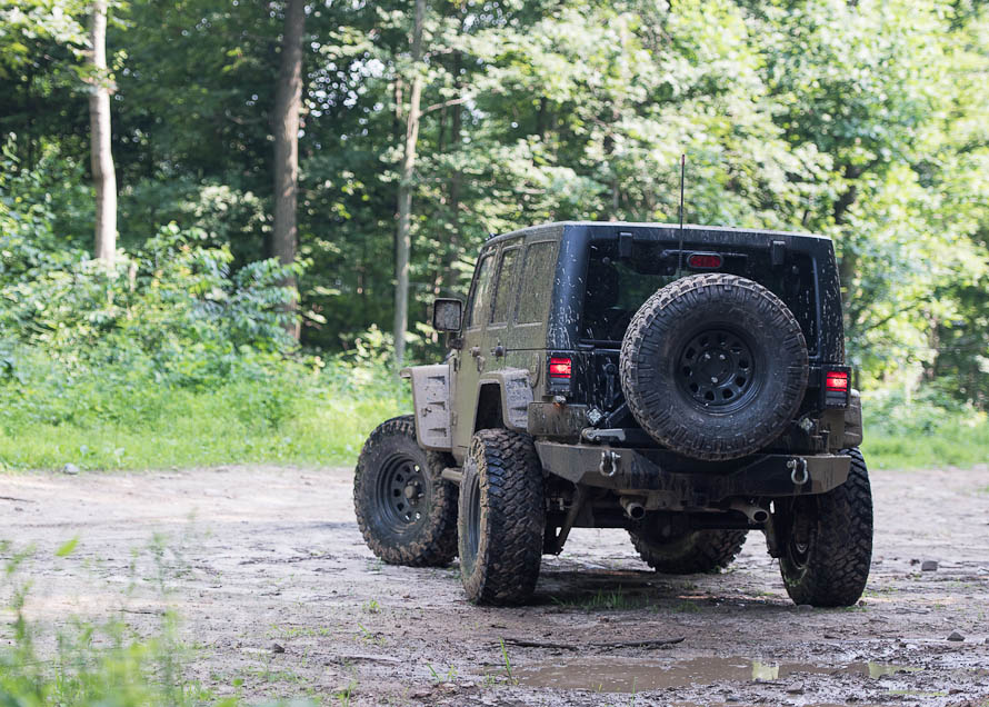 jk wrangler off roading on a trail